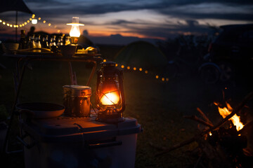 Antique lanterns for camping put on the box against the sunset background