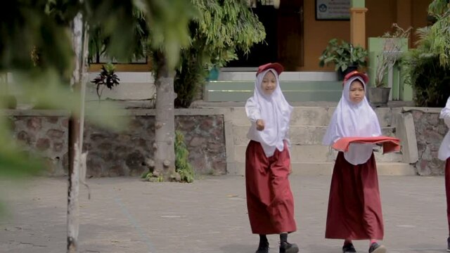 a portrait of indonesian elementary school flag raiser aranging the ranks