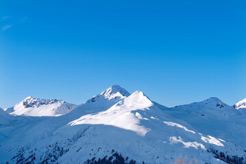 Switzerland, Alps, under the blue sky, thick snow on the top of the mountain, beautiful mountain scenery, panoramic shot