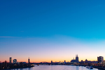 Fototapeta premium Dusk, Rhine in Cologne, Germany, Cologne Cathedral, World Heritage, long shot