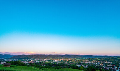 Under blue sky, a village on the green hillside, fresh air