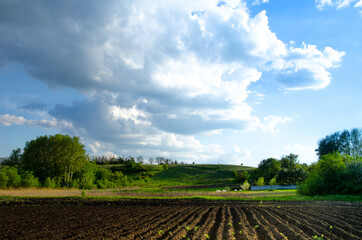 photo of rows of soil before planting. Furrow drawing in arable land prepared for spring sowing of agricultural crops. preparation for planting and growing crops.