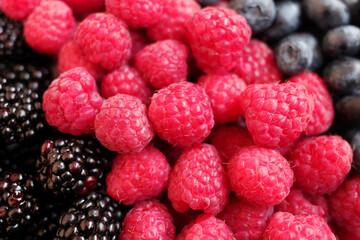 raspberries on black background