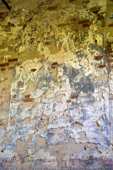 the remains of paintings on the walls of a destroyed Orthodox church