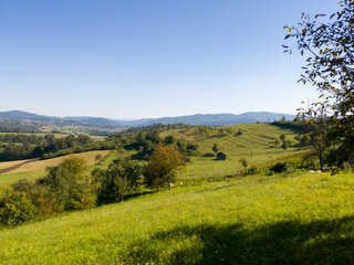 Scenic view of hilly countryside in village of Gornji Osječani near Doboj during clear sunny summer day.
