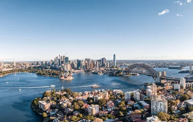 Poster de jardin Sydney Stunning wide angle panoramic aerial drone view of the City of Sydney, Australia skyline with Harbour Bridge and Kirribilli suburb in foreground. Photo shot in May 2021, showing newest skyscrapers.