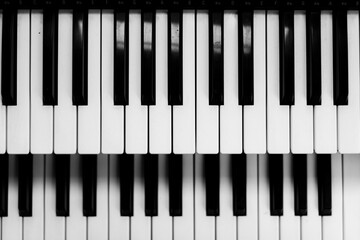 Close focus on upper row of piano keyboard in black and white.