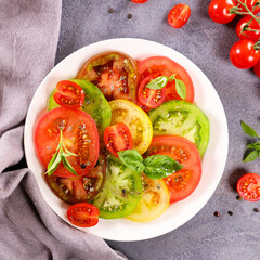 tomato salad slices with fresh basil