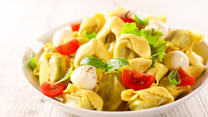 tortellini with mozzarella,  tomato and basil