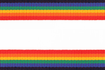 The rainbow belt or ribbon is an LGBTQ symbol, top and bottom on a white background.The boundaries...