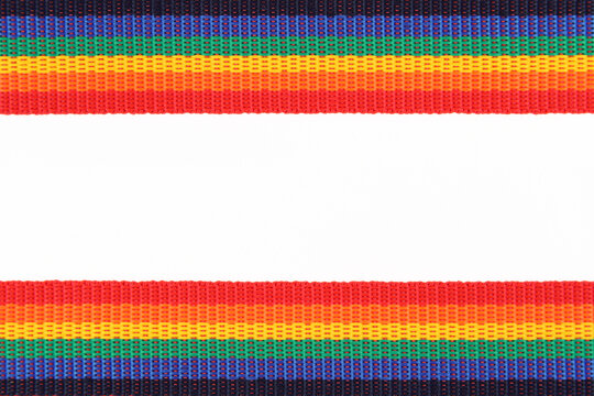 The rainbow belt or ribbon is an LGBTQ symbol, top and bottom on a white background.The boundaries of the pride of the gay and lesbian community, for the design of leaflets,greeting cards. Copyspace
