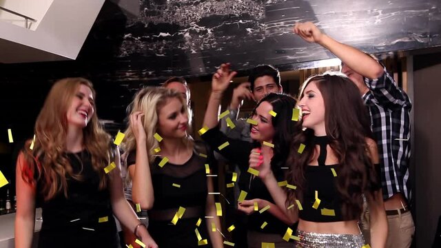 Animation of confetti falling over happy group of friends dancing at party