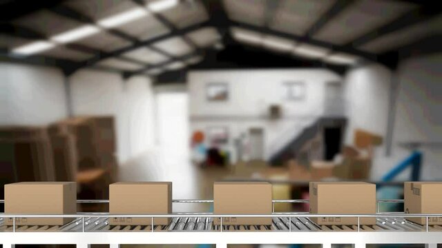 Multiple delivery boxes on conveyor belt against warehouse in background