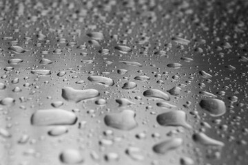 Drops of water in a metal surface. Drops of water in a metal surface. Abstract water drops on a...