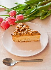 cheese cake decorated with carmel and peanuts