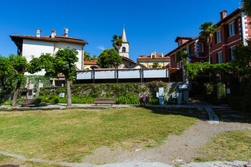 the fishermen's island (Isola dei pescatori) and its narrow and typical streets on the lake maggiore, near the town of Stresa, Italy - June 2021