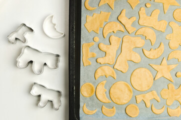 Christmas cookie cutter shapes and raw dough