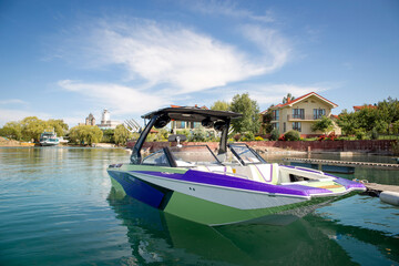 Naklejka na ściany i meble pleasure boat on the water on a sunny summer day