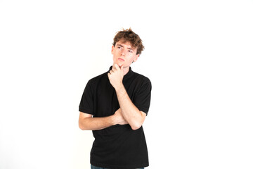 Guy thinking with his hand in the chin looking up, white background, 18-20 years old. White european guy.