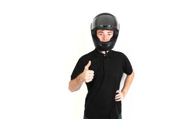 Teenager with a black motorcycle helmet with thumb up portrait, white background, 18-20 years old. White european guy.