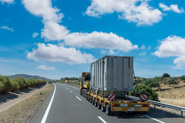 Special transport, semi-trailer truck with many axles and wheels to transport very heavy goods. - obrazy, fototapety, plakaty