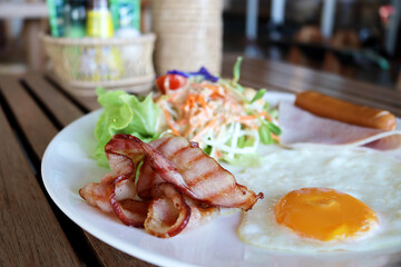 American breakfast on wooden table in restaurant