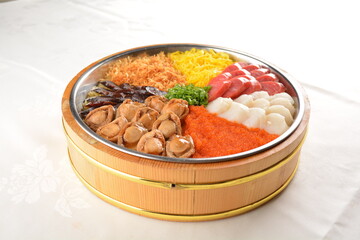cny colourful treasure pot set with rice, meat and seafood with abalone, scallop, sausage, egg, vegetable, pork, prawn, duck, chicken floss, waxed meat in big platter sushi bento takeaway banquet