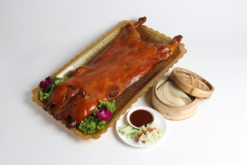 bbq roasted golden color whole suckling pig in crispy skin on gold background asian meat menu with...