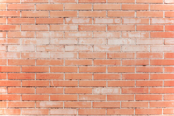 A wall of worn red bricks, with the remnants of some cement. Useful backdrop texture, tenuous faded colors.
