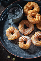 Homemade spanish donuts with powdered sugar. Donuts baked at home.