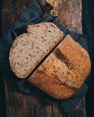 Top view of wholemeal rye bread enriched with many seeds in its composition. Bread placed on a...