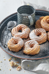 Homemade spanish donuts with powdered sugar. Traditional spanish cuisine.