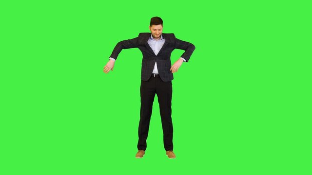 Funny businessman make robot moves Formal adult business man boss perform robotic dance movements on a Green Screen, Chroma Key.