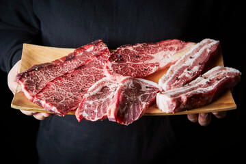 Fresh raw beef and pork on a cutting board