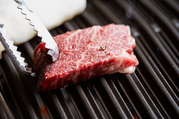 Grilled fresh raw beef on the grill