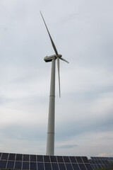 Solar panels (solar panels) and a wind generator (wind farm or wind turbine). The concept of alternative sources of electricity.