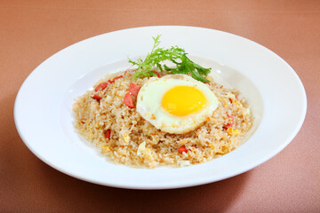 asian fried rice with egg, ham, crispy chicken and seafood in bake cheese western halal menu