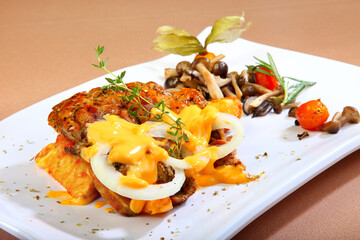 bbq grill bake meat platter with chicken cutlet, beef steak, pork chop in cheesy cream sauce French fries and salad western menu