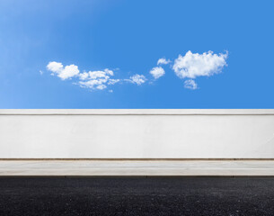 white brick wall and road with sky background