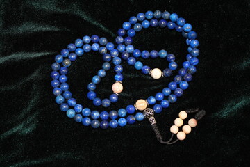 Buddhist rosary beads made of Afghan lapis lazuli and jasper. There are 108 beads in the rosary.