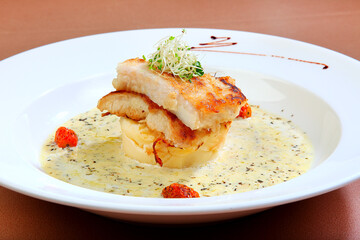 grill bbq bake seafood platter with salmon fish, cod fish, muscle, prawn, salad and mash potato in chef sauce western halal menu