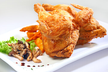 bbq grill bake meat platter with chicken cutlet, beef steak, pork chop in cheesy cream sauce French fries and salad western menu