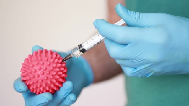 making injection and holding pink ball