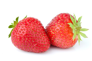 Two organic ripe strawberries in closeup.