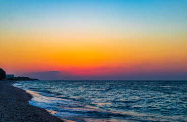 The most beautiful colorful sunset at Ialysos Beach Rhodes Greece.