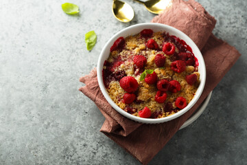 Traditional homemade raspberry crumble with fresh mint
