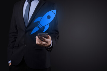 Start up concept with businessman holding abstract digital rocket icon rocket is launching and soar...