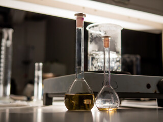 Chemical experiment in the darkness of the laboratory. Selective focus.