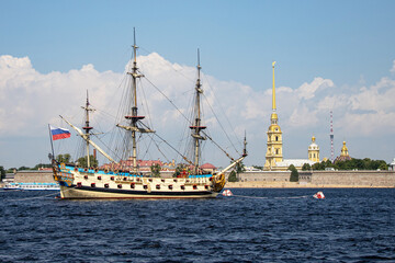 Sailboat Poltava in front of the Peter and Paul Fortress in St. Petersburg