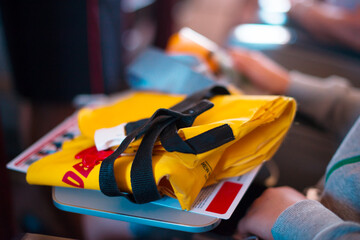 Yellow life jacket in an airplane